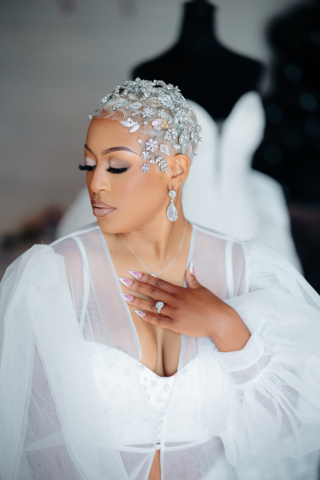 Bride wearing an intricate silver headpiece