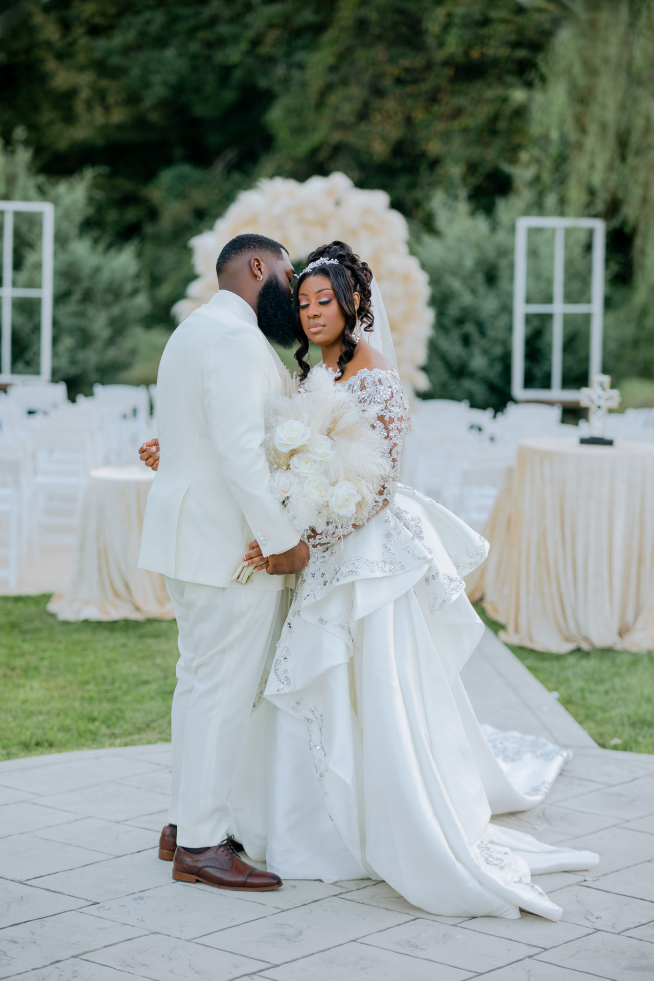 Newlyweds sharing a quiet moment at their outdoor reception