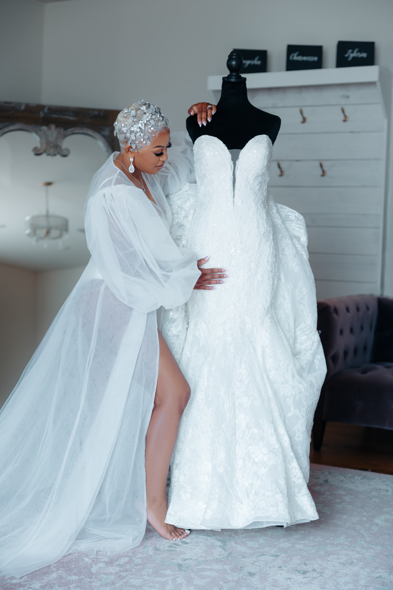 Bride admiring her wedding gown